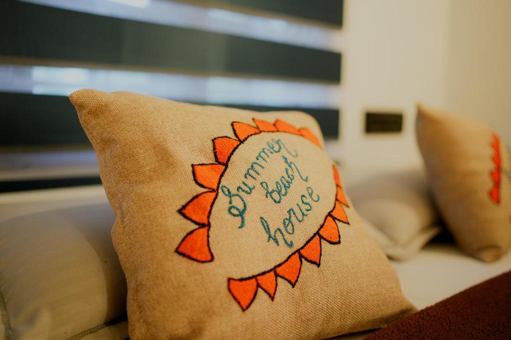 a pillow with the words tomorrow is a new world at Summer beach house Alleppy beach in Alleppey