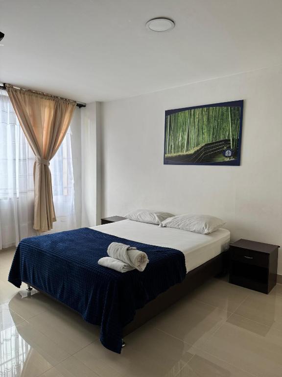 Postel nebo postele na pokoji v ubytování Hotel Catalina Plaza Pereira