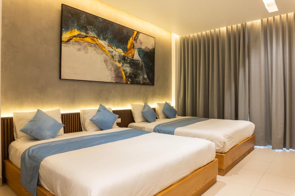 Postel nebo postele na pokoji v ubytování The Stay Saigon Riverfront