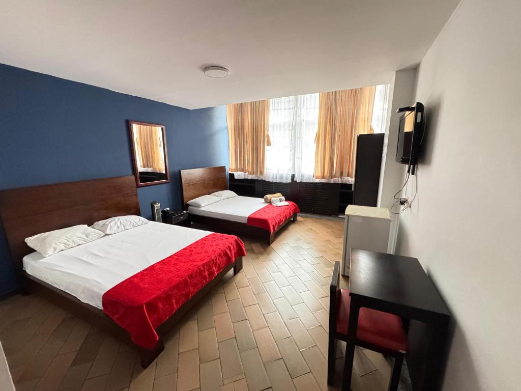 Postel nebo postele na pokoji v ubytování Hotel Catalina Plaza Pereira