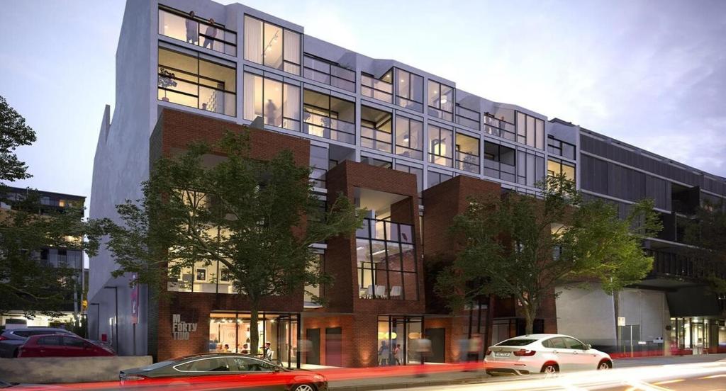 a building with cars parked in front of it at Brand new 1 bedroom apartment in Canberra Centre in Canberra