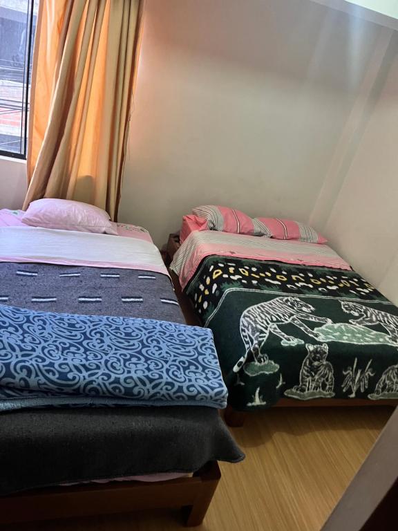 Postel nebo postele na pokoji v ubytování Montañero Hostel