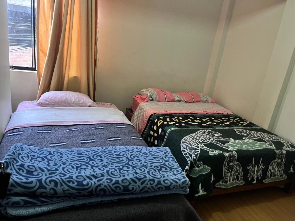 Postel nebo postele na pokoji v ubytování Montañero Hostel