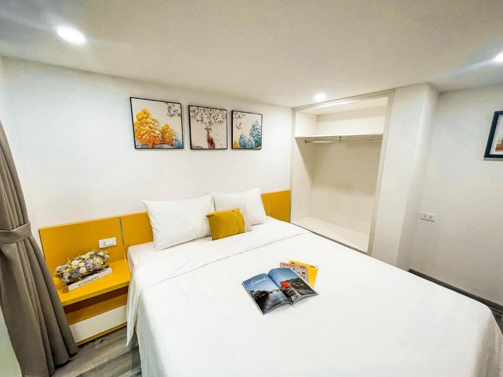Postel nebo postele na pokoji v ubytování Mango Apartment and Homestay - HaNoi railway station