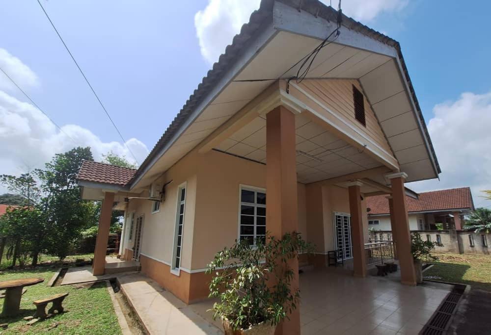a small house with a patio in front of it at DN Homestay Kuala Terengganu - Feel At Home in Kuala Terengganu