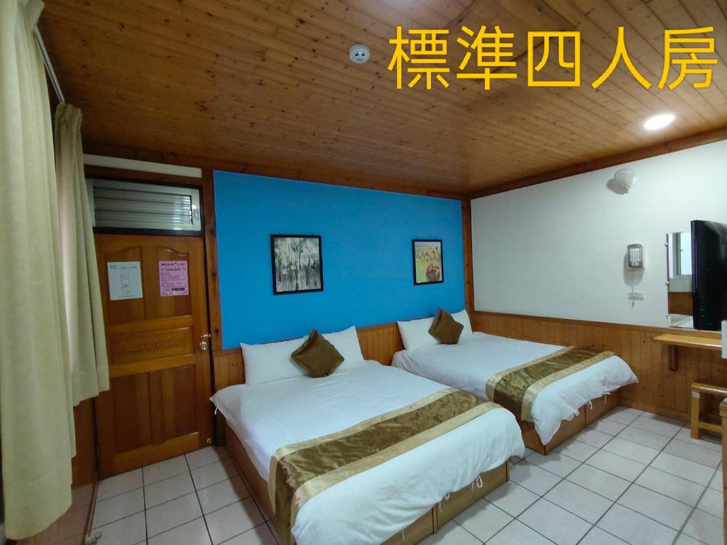 Postel nebo postele na pokoji v ubytování Xitou Tianpin Homestay