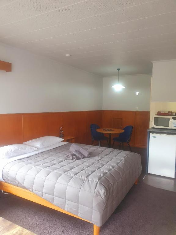 Postel nebo postele na pokoji v ubytování Geraldine Motels