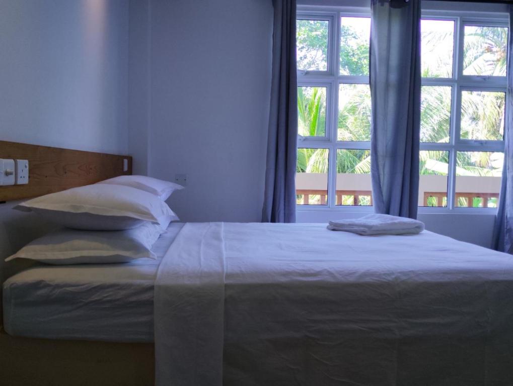 Postel nebo postele na pokoji v ubytování Kilavethi Retreat
