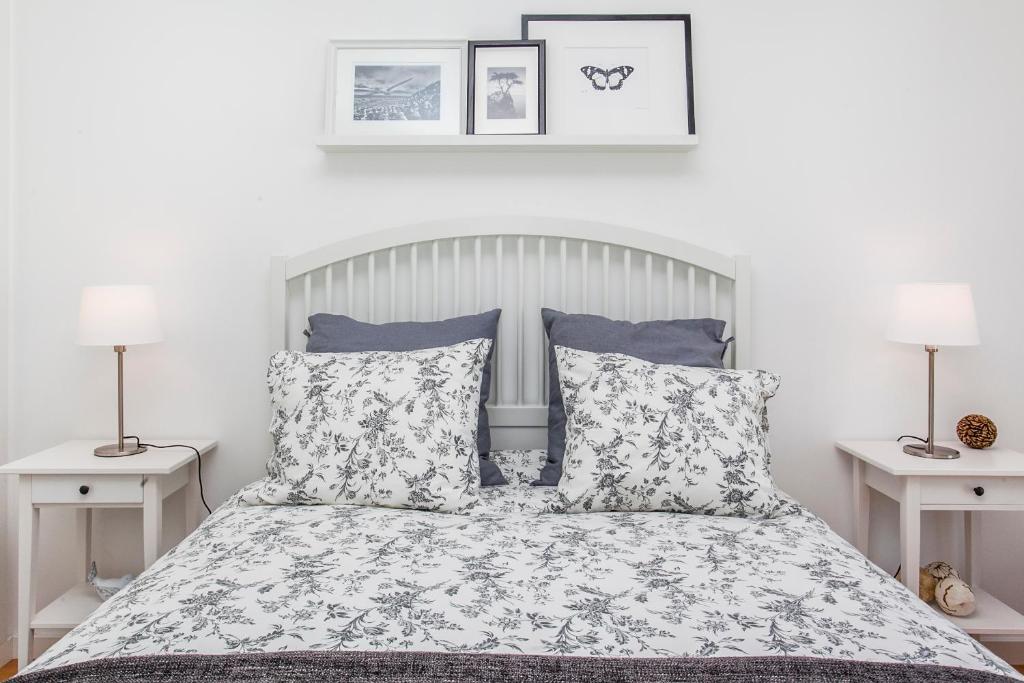 Uma cama ou camas num quarto em Arco da Graça Apartment