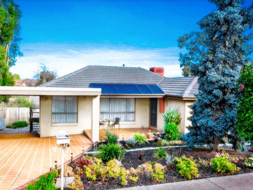 a white house with a garden in front of it at Home in Doncaster with Gardens, Near Shops & Transport in Doncaster