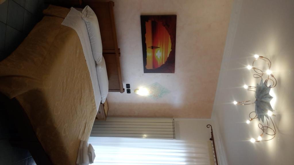Postel nebo postele na pokoji v ubytování Agriturismo Mare e Monti