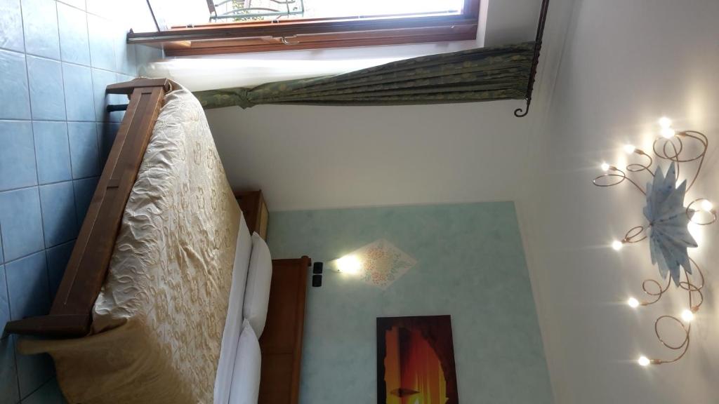 Postel nebo postele na pokoji v ubytování Agriturismo Mare e Monti
