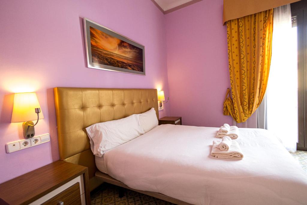 Postel nebo postele na pokoji v ubytování Hotel Llar de Capitans