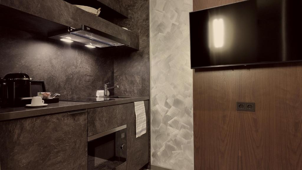 Kuchyň nebo kuchyňský kout v ubytování Bellman Hotel