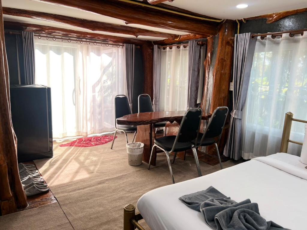 Postel nebo postele na pokoji v ubytování Sor Boutique Resort Chiangrai