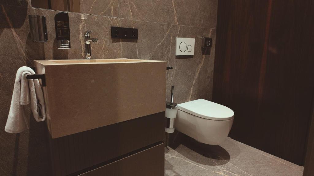 Koupelna v ubytování Bellman Hotel