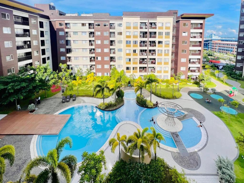 an aerial view of a resort with a swimming pool at Avida Towers Atria Iloilo in Iloilo City
