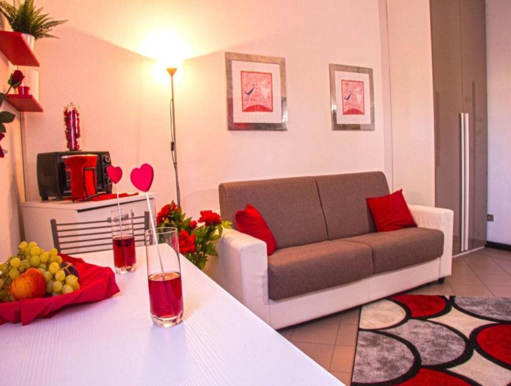 a living room with a couch and a table at The Relax Apartment in Montagnana