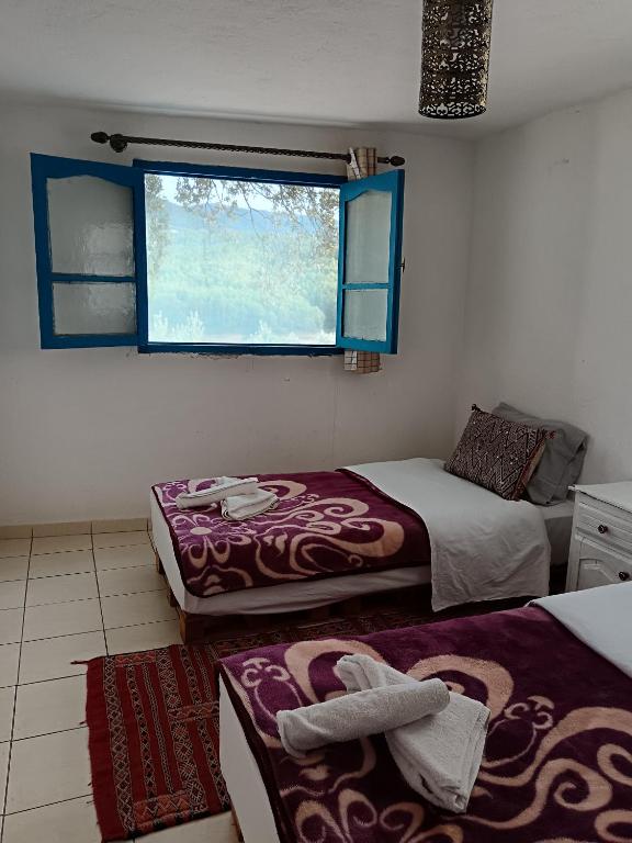 Postel nebo postele na pokoji v ubytování Relais De Tahla