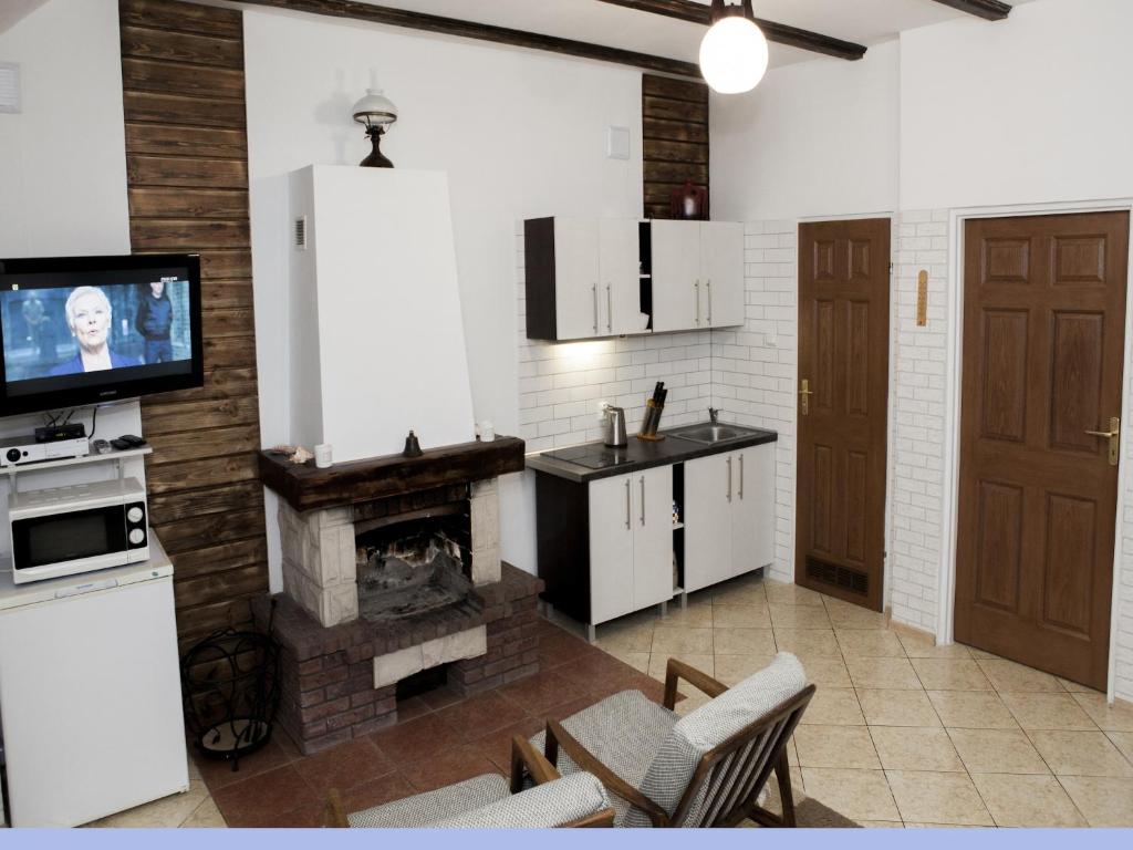 Kuchyňa alebo kuchynka v ubytovaní Apartment in Rowy with a garden