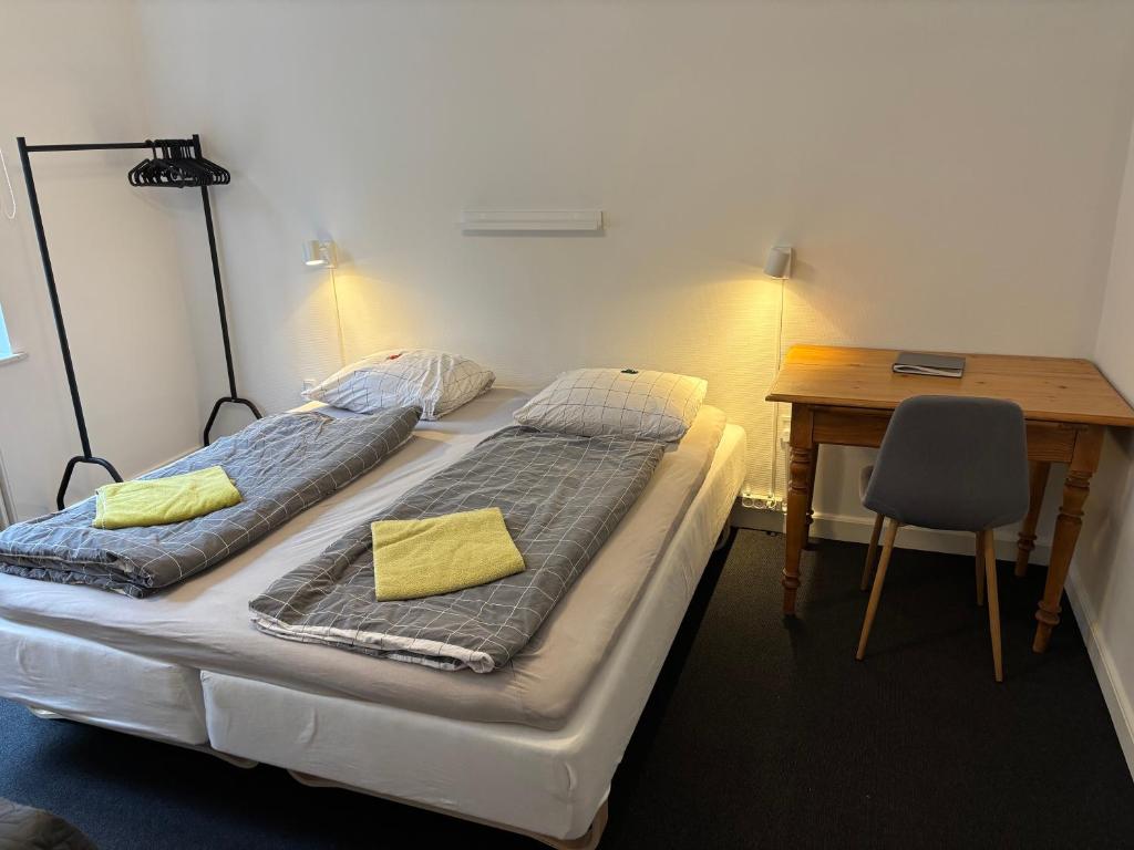En eller flere senger på et rom på Siesta Vejle
