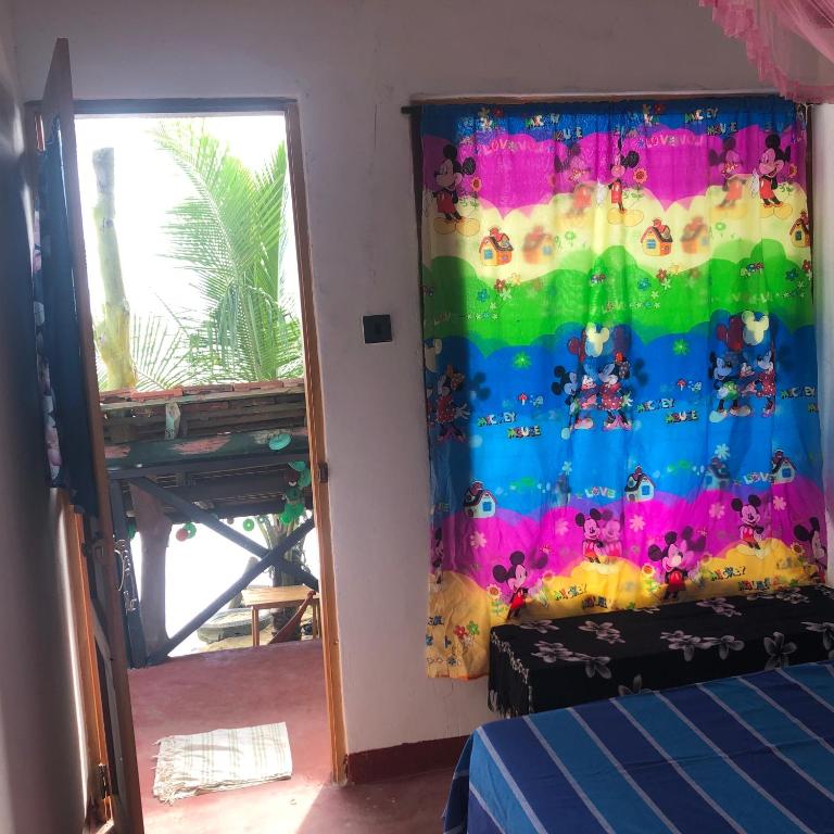 Postel nebo postele na pokoji v ubytování Ceylon Beach Home