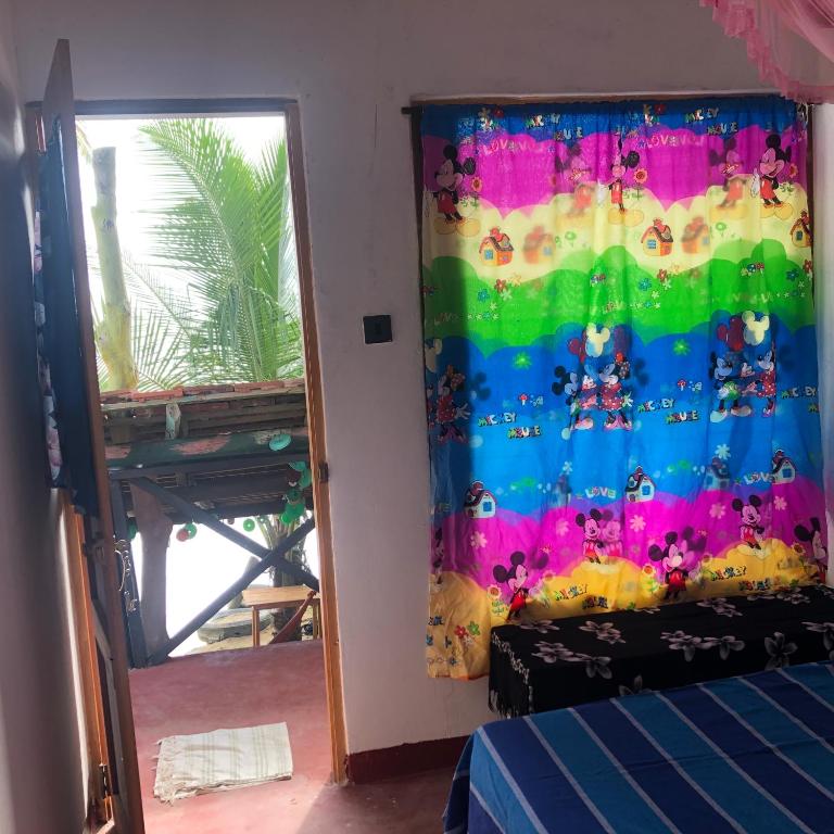 Postel nebo postele na pokoji v ubytování Ceylon Beach Home
