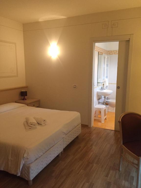 Postel nebo postele na pokoji v ubytování Albergo La Quiete
