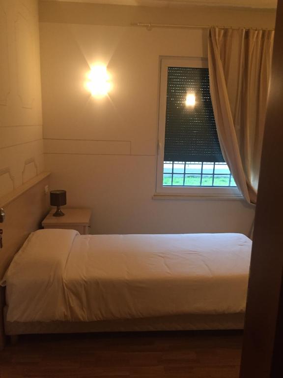 Postel nebo postele na pokoji v ubytování Albergo La Quiete