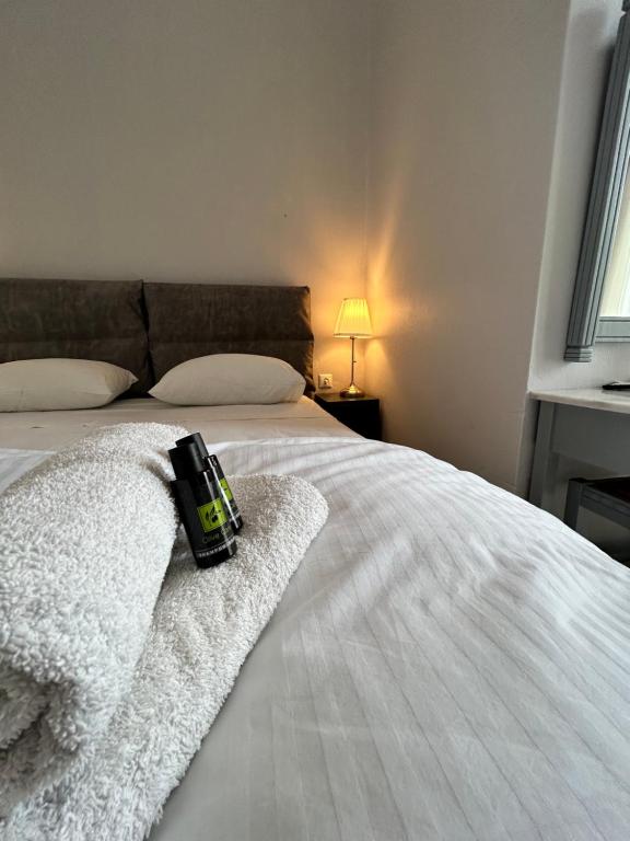 Łóżko lub łóżka w pokoju w obiekcie Tinion Urban Hotel