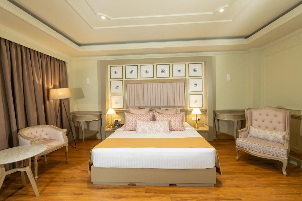 Grandeeza Hotel by Galisonにあるベッド