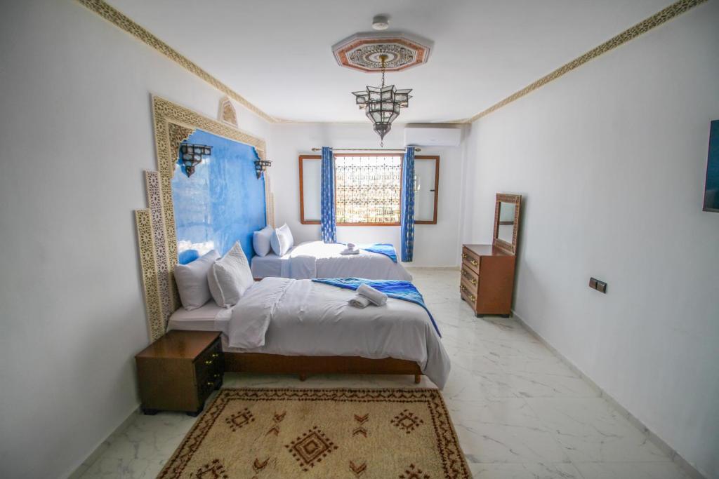 Postel nebo postele na pokoji v ubytování Riad Zaya Fes