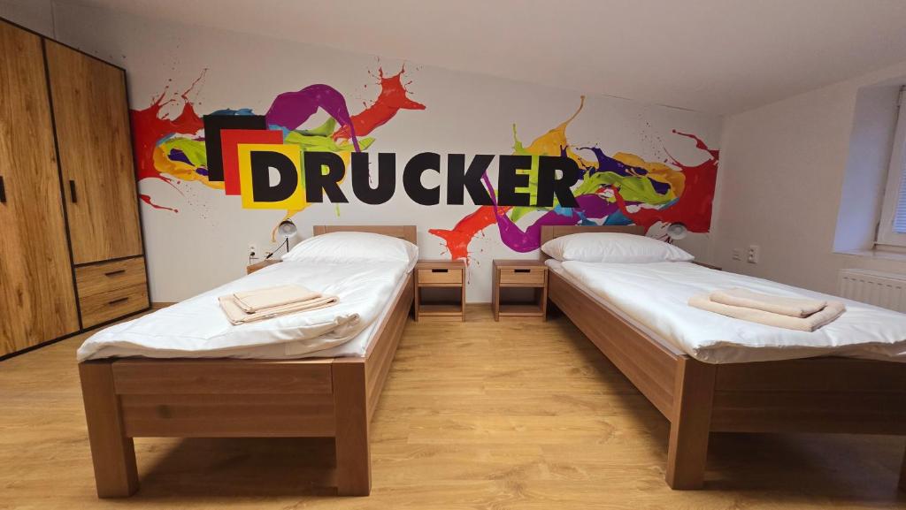 Postel nebo postele na pokoji v ubytování Penzion DRUCKER