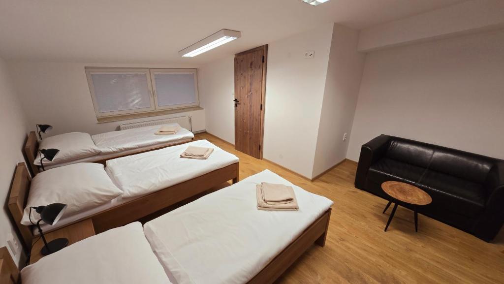 Postel nebo postele na pokoji v ubytování Penzion DRUCKER