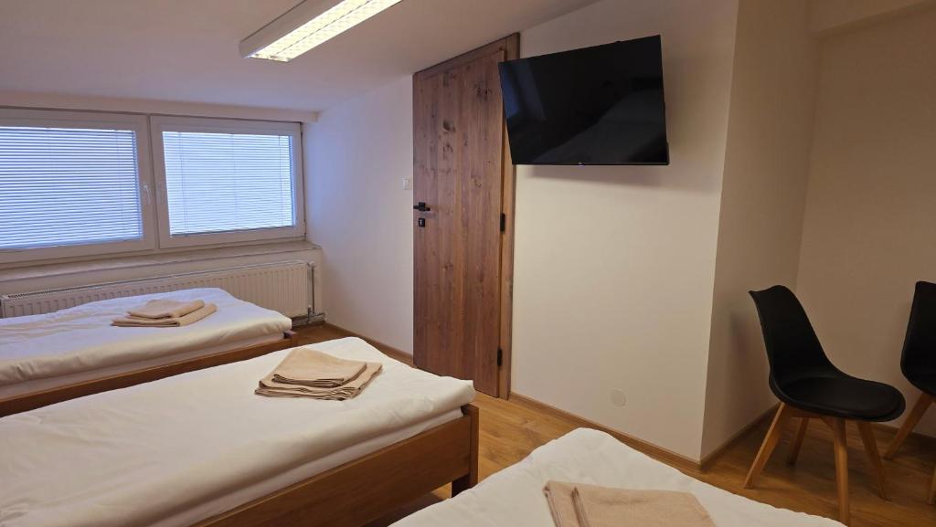 Postel nebo postele na pokoji v ubytování Penzion DRUCKER