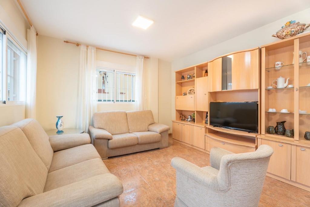 A television and/or entertainment centre at Herba Sana