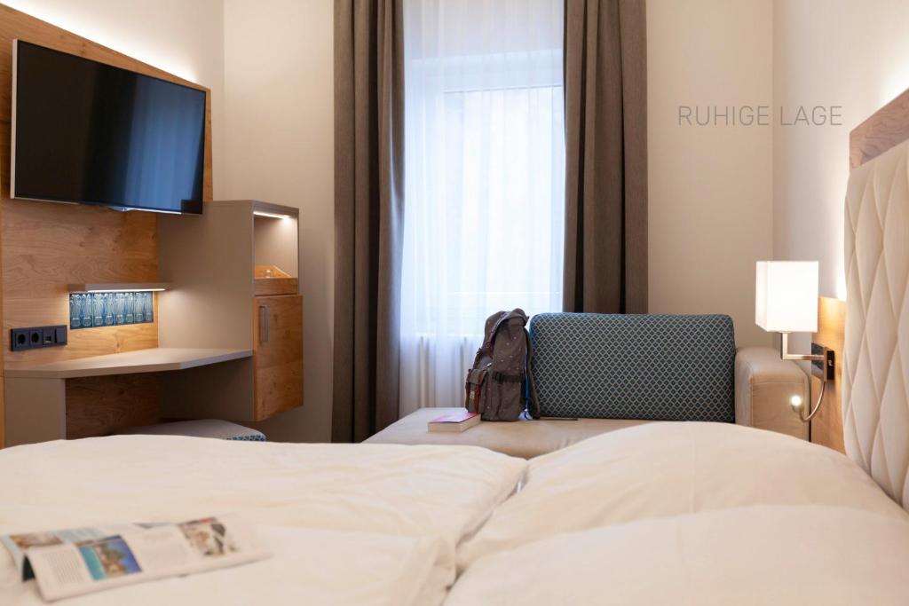 Postel nebo postele na pokoji v ubytování Hotel Ross