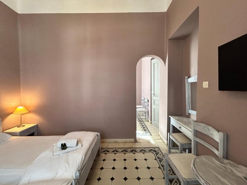 Łóżko lub łóżka w pokoju w obiekcie Tinion Urban Hotel
