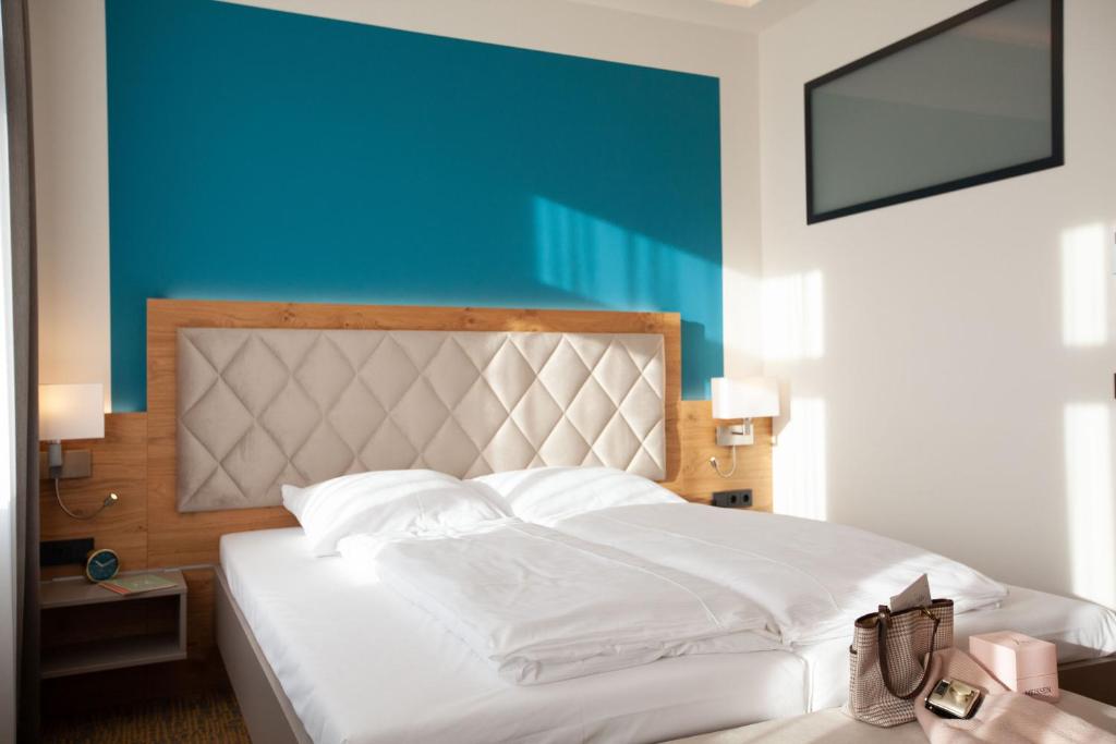 Postel nebo postele na pokoji v ubytování Hotel Ross