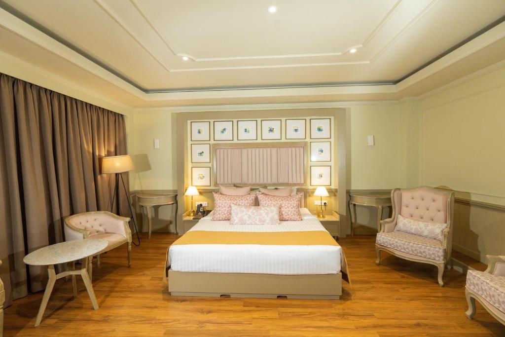 Grandeeza Hotel by Galisonにあるベッド