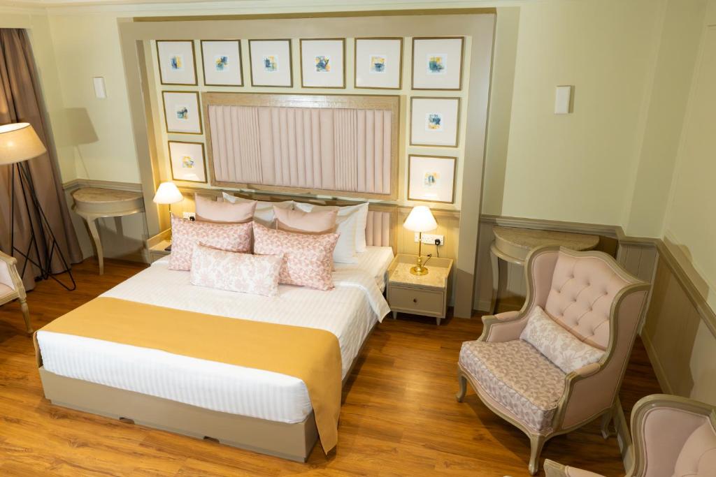 Grandeeza Hotel by Galisonにあるベッド