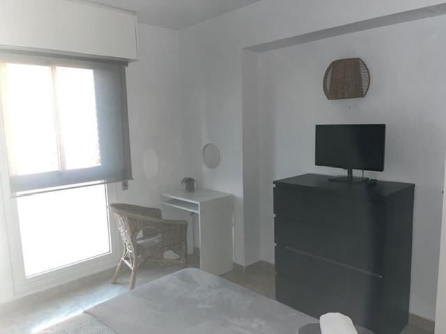 Telewizja i/lub zestaw kina domowego w obiekcie Apartamento Familiar