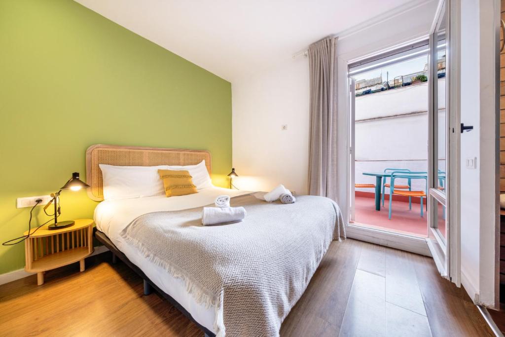Posteľ alebo postele v izbe v ubytovaní Caliu Apartments Barcelona - Fira