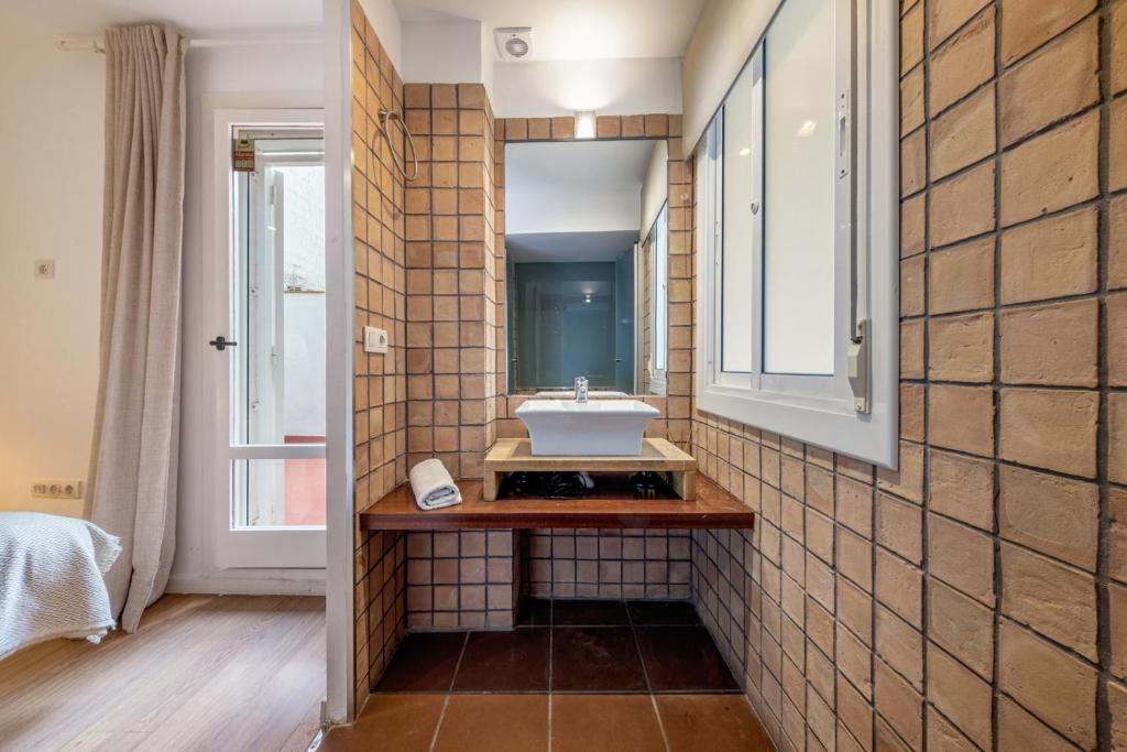 Posteľ alebo postele v izbe v ubytovaní Caliu Apartments Barcelona - Fira