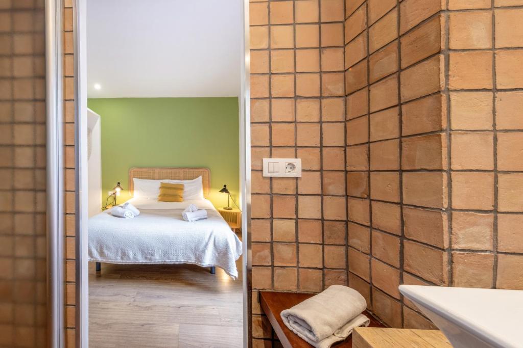 Posteľ alebo postele v izbe v ubytovaní Caliu Apartments Barcelona - Fira
