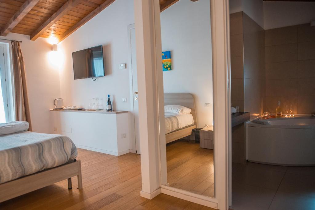 Postel nebo postele na pokoji v ubytování Tulliani Residenze Matera