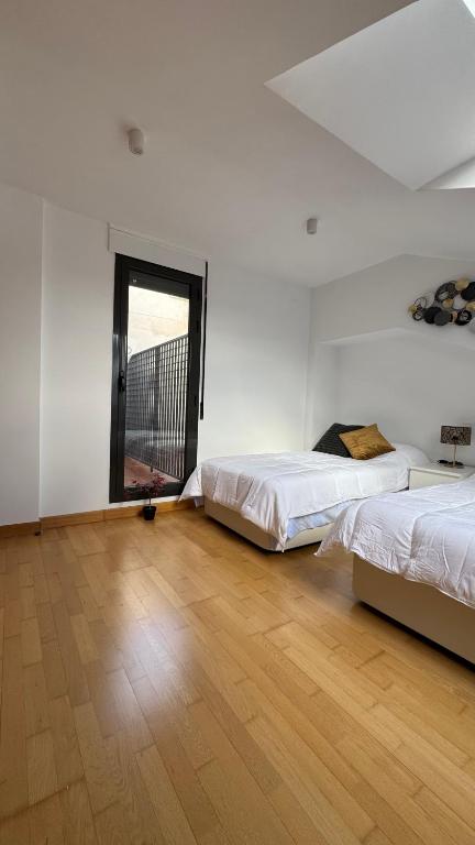 Postel nebo postele na pokoji v ubytování Apartamentos Suites Olmedo
