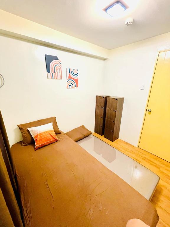 Postel nebo postele na pokoji v ubytování Seawind Condominium