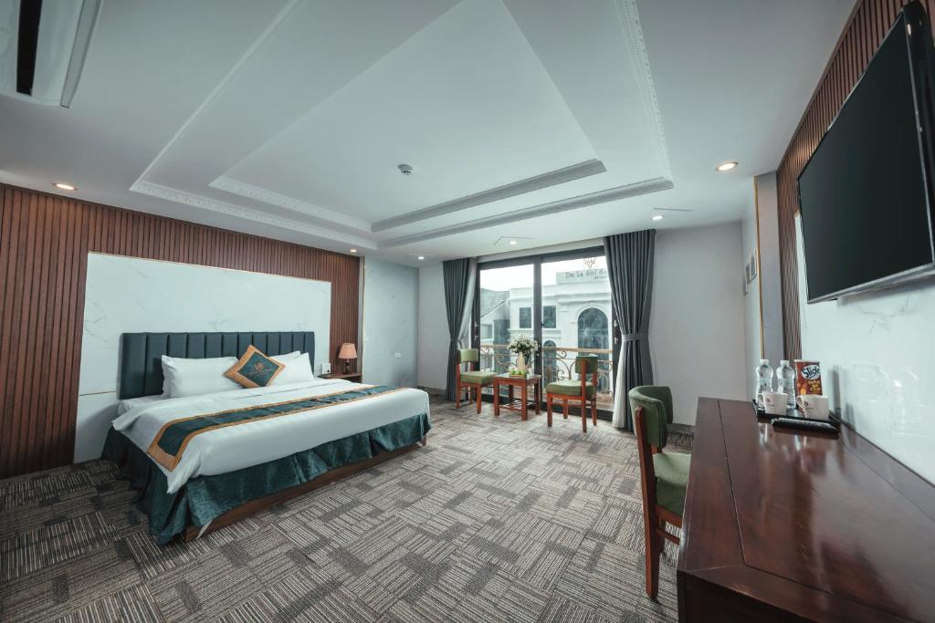 Postel nebo postele na pokoji v ubytování Central Sapa March Hotel