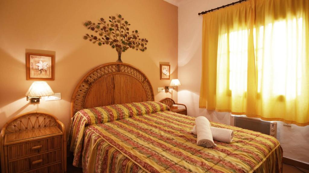 A bed or beds in a room at Villa Maro Casitas Select